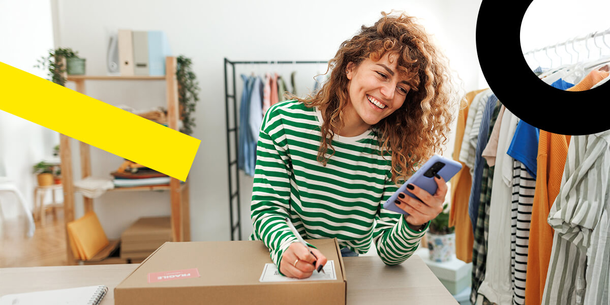 Clothing store owner engaging with customers using GoTo Connect cloud communication platform.