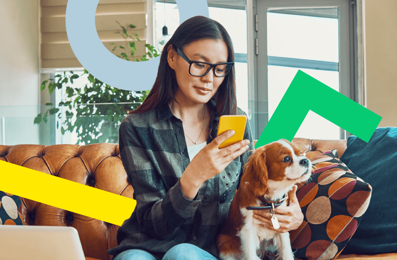 A woman accessing her number through GoToConnect on her mobile device in the comfort of her living room.